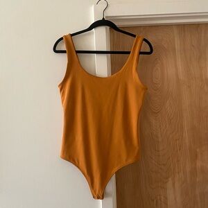 Express mustard yellow bodysuit size M